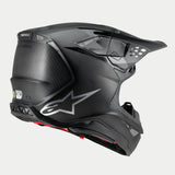 Alpinestars Supertech M10 Fame Helmet, Motocross Helmet, Black Carbon Matte and Glossy, rear-three-quarter view featuring visible carbon fiber texture, silver logo, and multiple integrated ventilation ports, advanced off-road head protection