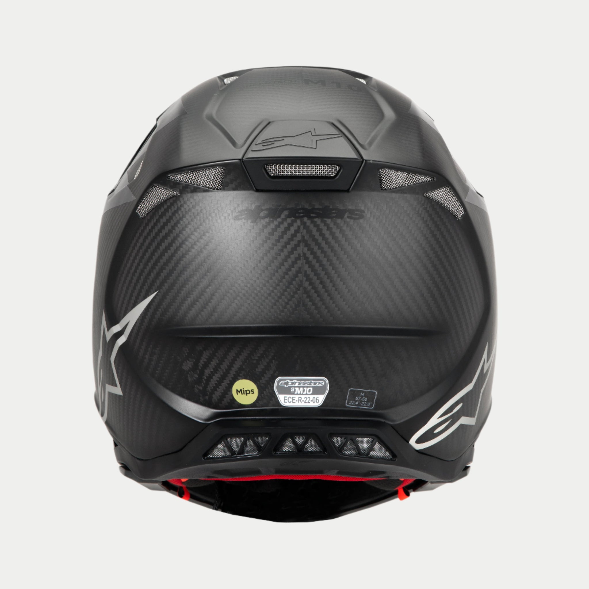 Alpinestars Supertech M10 Fame ECE 22.06 Helmet, Rear View, Black Carbon Matte and Glossy, featuring visible carbon fiber weave, mesh ventilation ports, MIPS and ECE certification labels, and Alpinestars logo.
