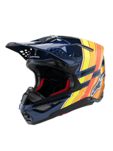Alpinestars Supertech M10 TLD Edition 25 Helmet, Motocross Helmet, Glossy Dark Blue with Orange and Yellow Fluo graphics, featuring red interior padding, aerodynamic shell with multiple ventilation ports, Troy Lee Designs branding on the peak, professional off-road racing gear