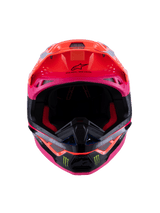 Alpinestars Supertech M10 Deegan Monster ECE 22.06 Helmet, front view of motocross helmet in Orange Fluo, Purple, and Pink Gloss, featuring Monster Energy claw logos on the black chin bar, aerodynamic design with integrated ventilation ports, premium off-road racing head protection