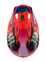 Alpinestars Supertech M10 Deegan Monster Helmet, Motocross Helmet, Orange Fluo with Purple and Pink gradient, featuring Green Monster Energy claw logos and black graphics, top-down view showing aerodynamic profile and ventilation ports