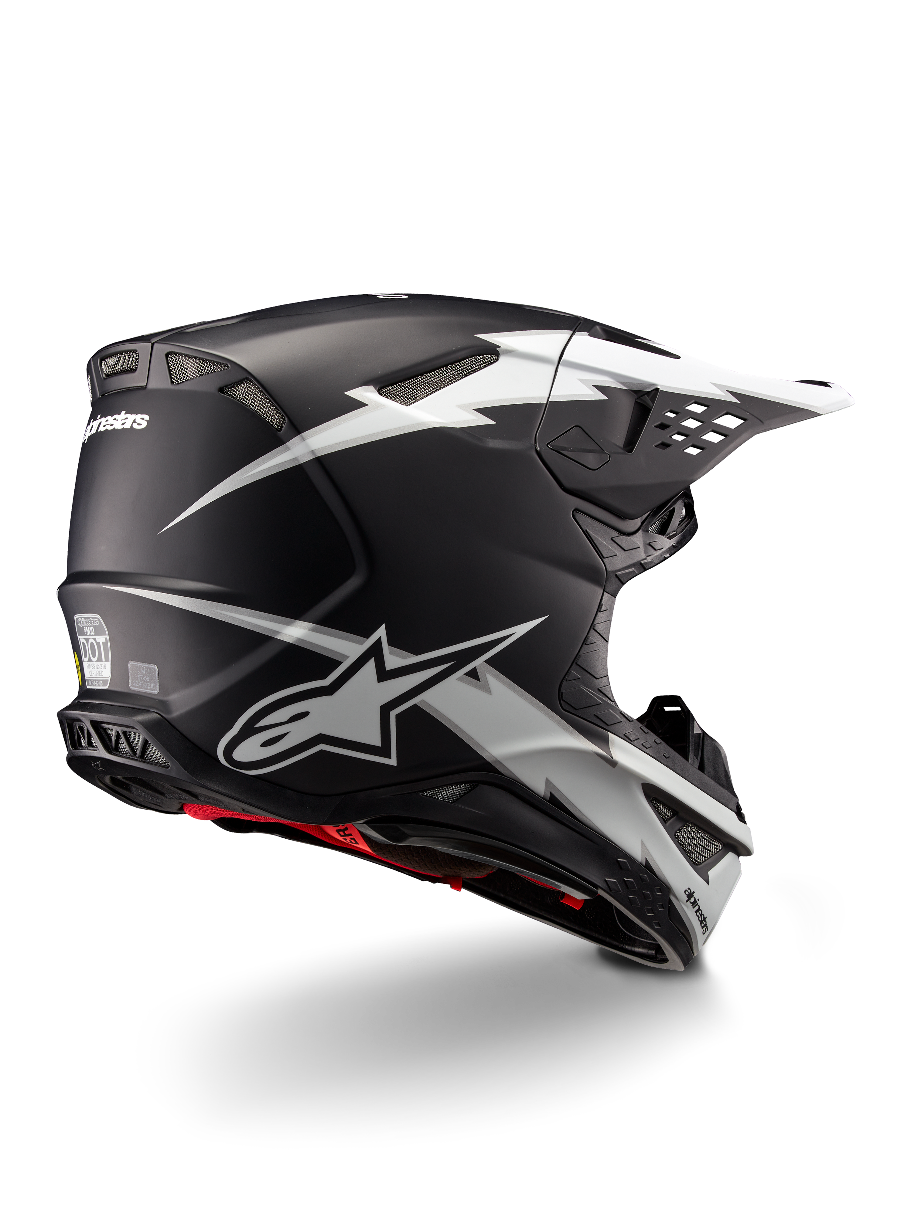 Alpinestars Supertech M10 Ampress Helmet, Motocross Helmet, Black and White Matte, featuring bold white lightning bolt graphics on a matte black shell, rear three-quarter view showing Alpinestars branding and ventilation ports