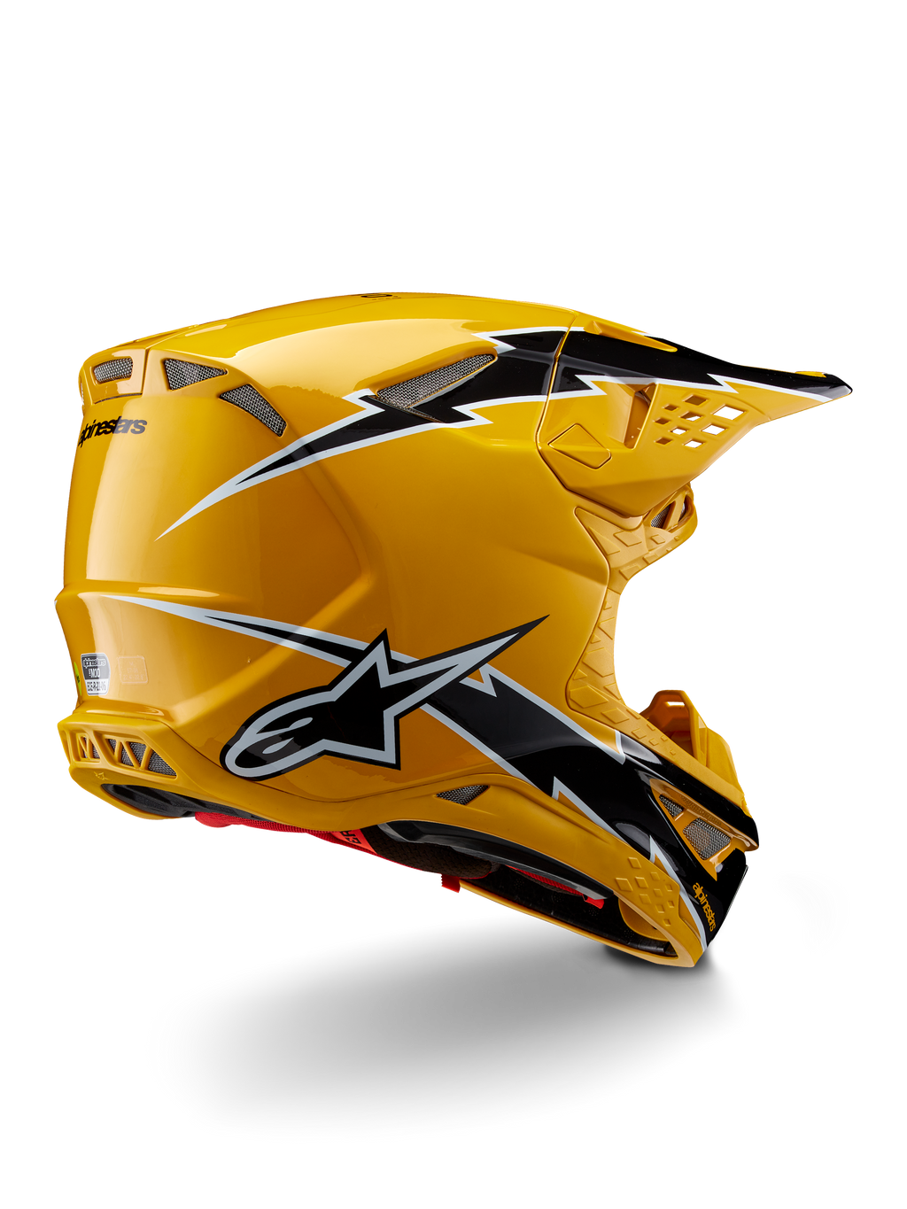 Alpinestars Supertech M10 Ampress helm, motorcrosshelm, glanzend zwart en geel, met een hoogglans gele afwerking en zwart-witte graphics in bliksemstijl, driekwart achteraanzicht met aerodynamische schaal en geïntegreerde ventilatieopeningen.