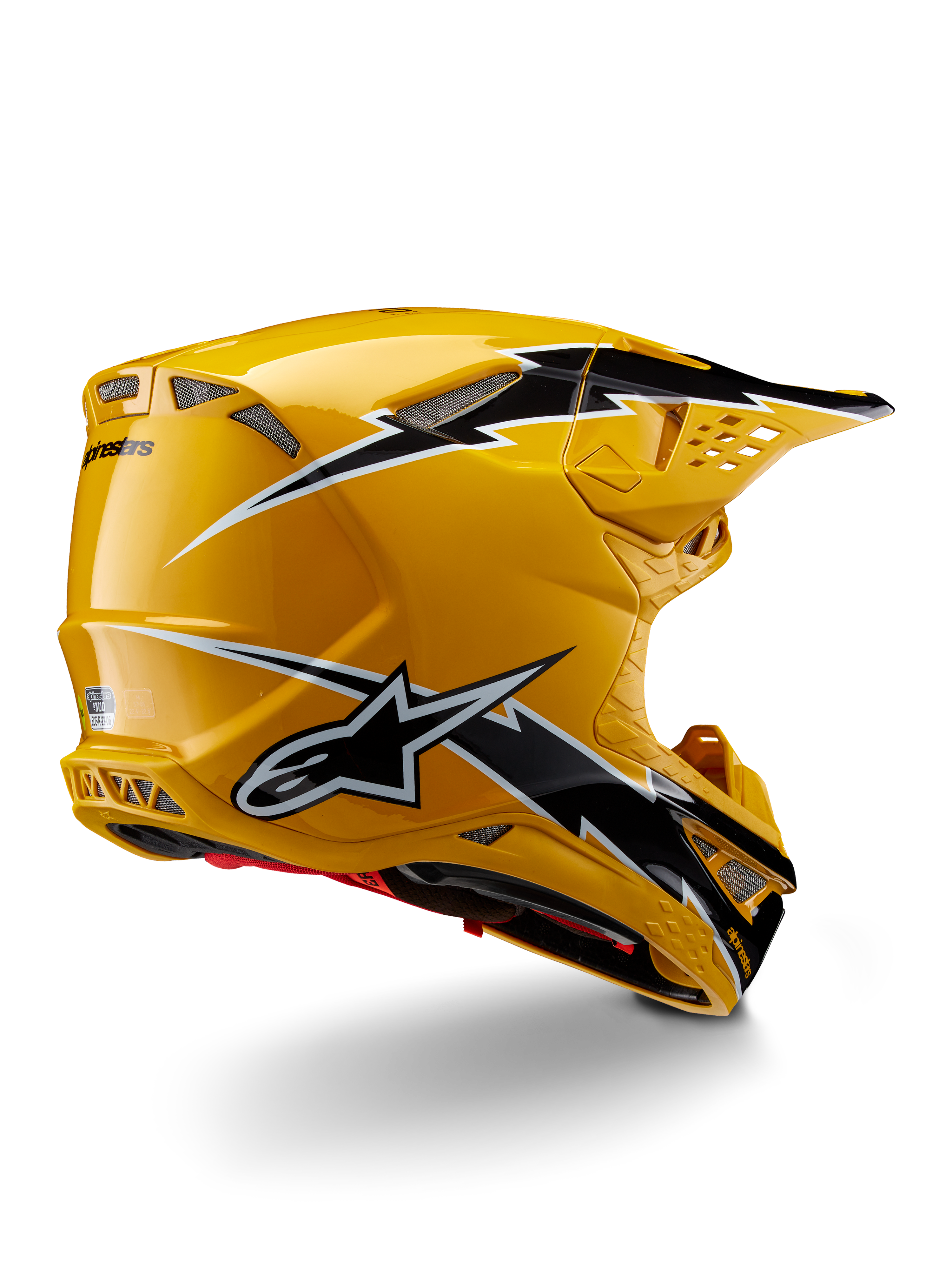 Alpinestars Supertech M10 Ampress helm, motorcrosshelm, glanzend zwart en geel, met een hoogglans gele afwerking en zwart-witte graphics in bliksemstijl, driekwart achteraanzicht met aerodynamische schaal en geïntegreerde ventilatieopeningen.