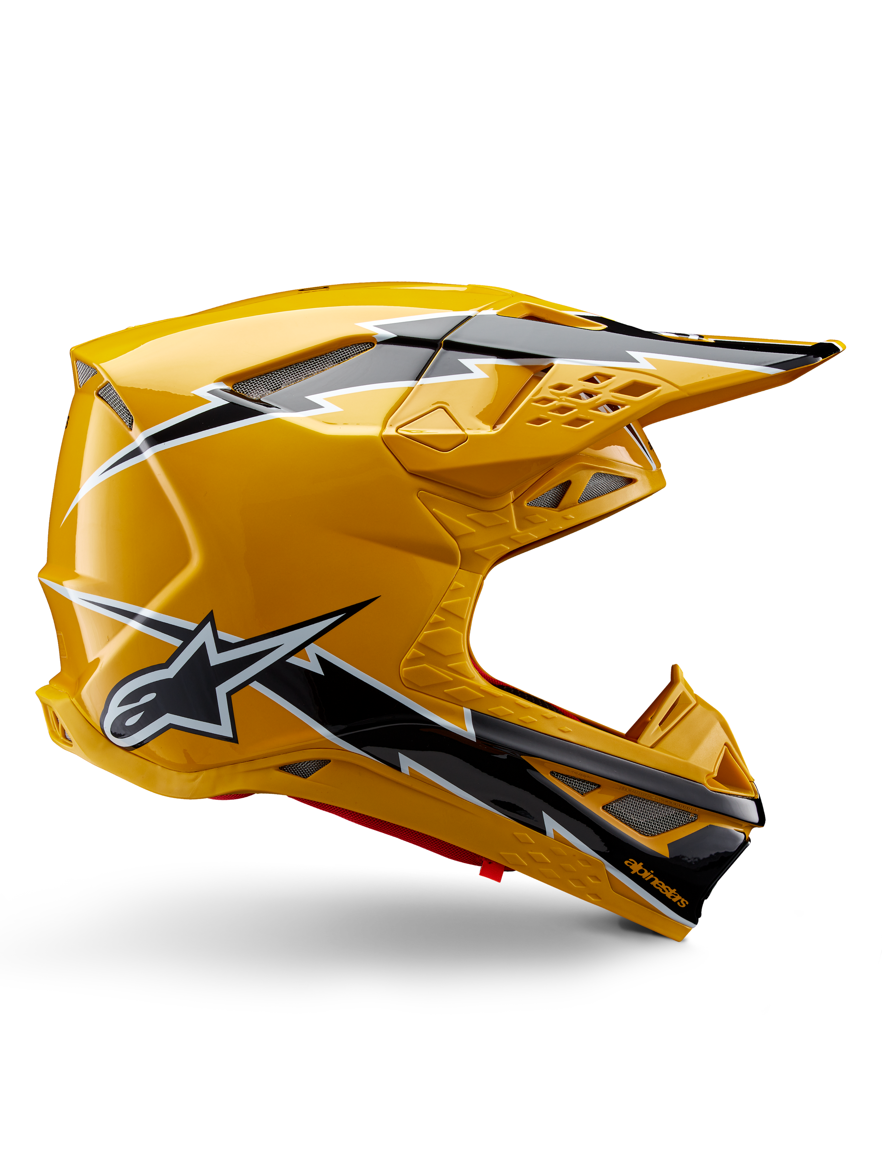 Alpinestars Supertech M10 Ampress helm, motorcrosshelm, glanzend zwart en geel, zijprofiel met opvallende zwart-witte bliksemgraphics, Alpinestars sterlogo, aerodynamisch ontwerp met geïntegreerde ventilatiepoorten en verstelbaar vizier.