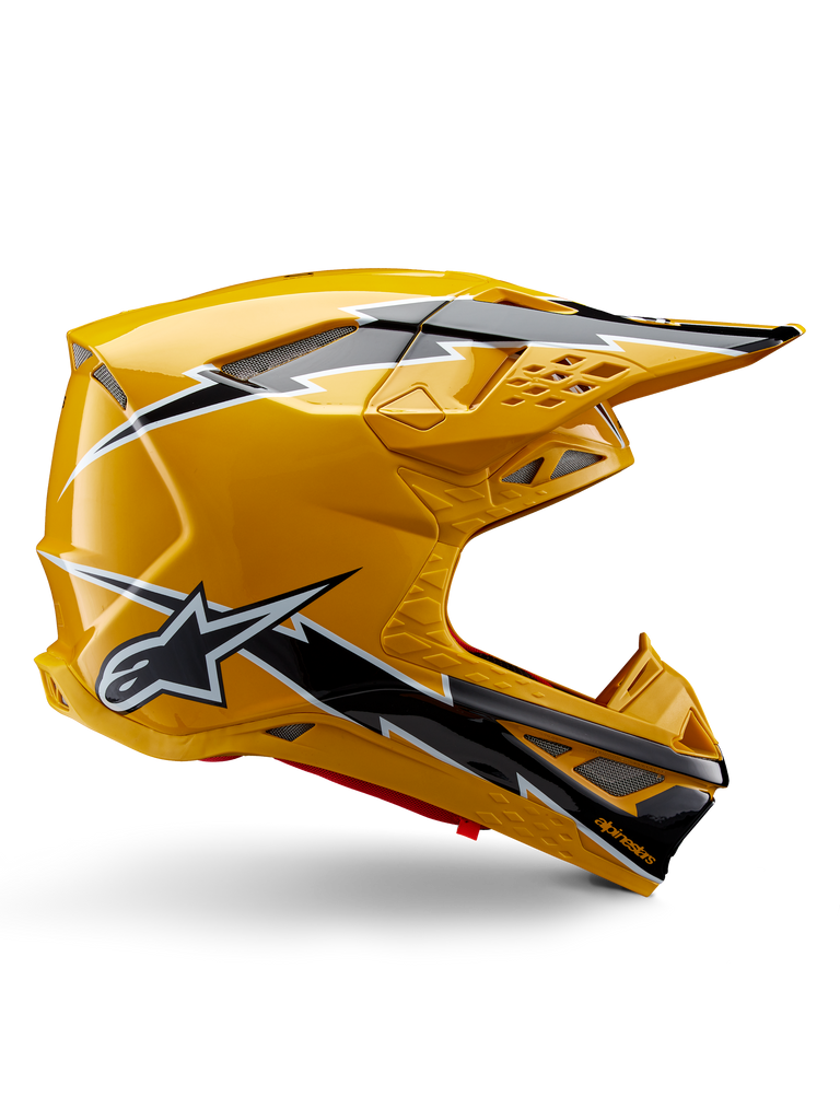 Alpinestars Supertech M10 Ampress Helmet, Motocross Helmet, Black and Yellow Glossy, side profile showing bold black and white lightning graphics, Alpinestars star logo, aerodynamic design with integrated ventilation ports and adjustable visor.