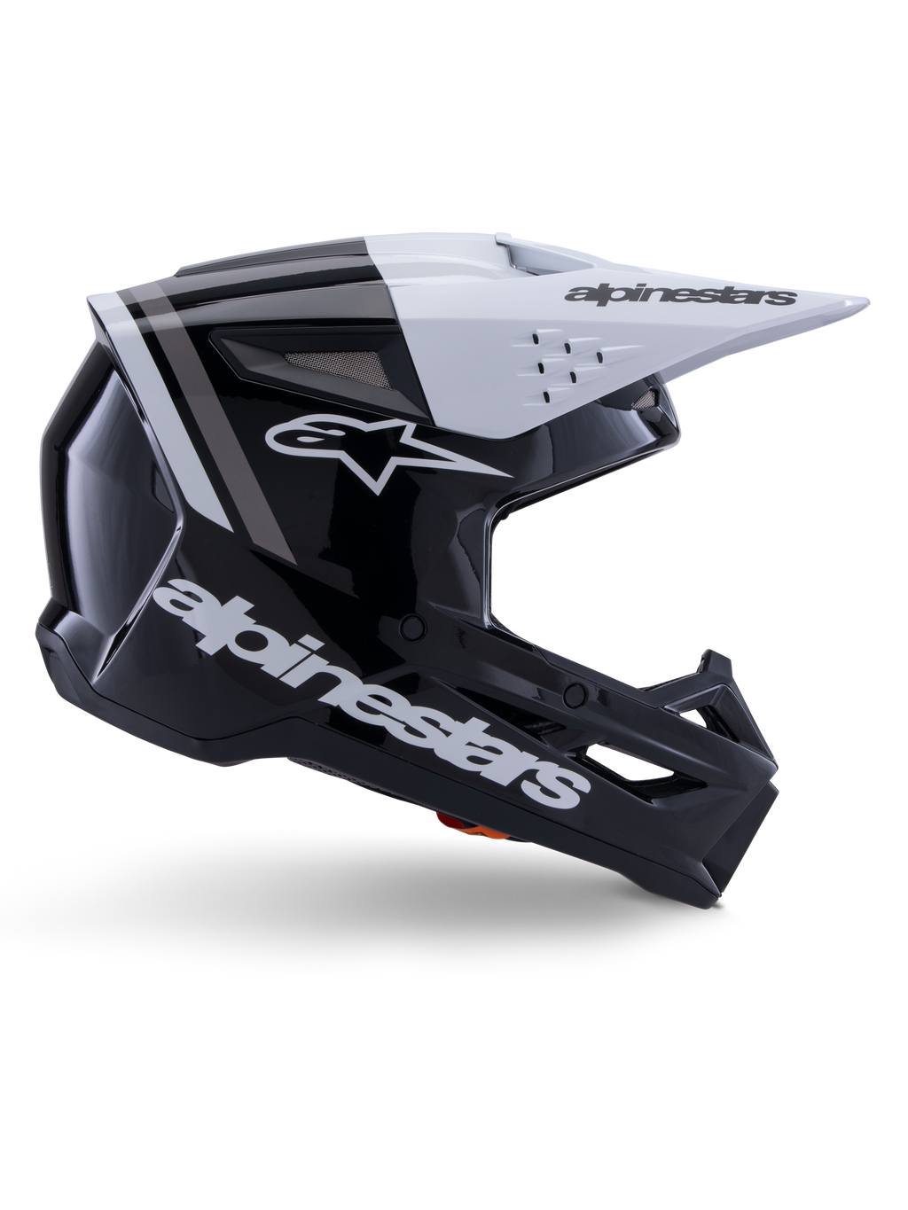 Alpinestars S-M3 Radium helm, motorcross off-road helm, glanzend zwart, wit en grijs, hoekig aerodynamisch ontwerp met ventilatieopeningen, zijaanzicht, glanzende afwerking met grijze strepen en een wit vizier met Alpinestars-branding