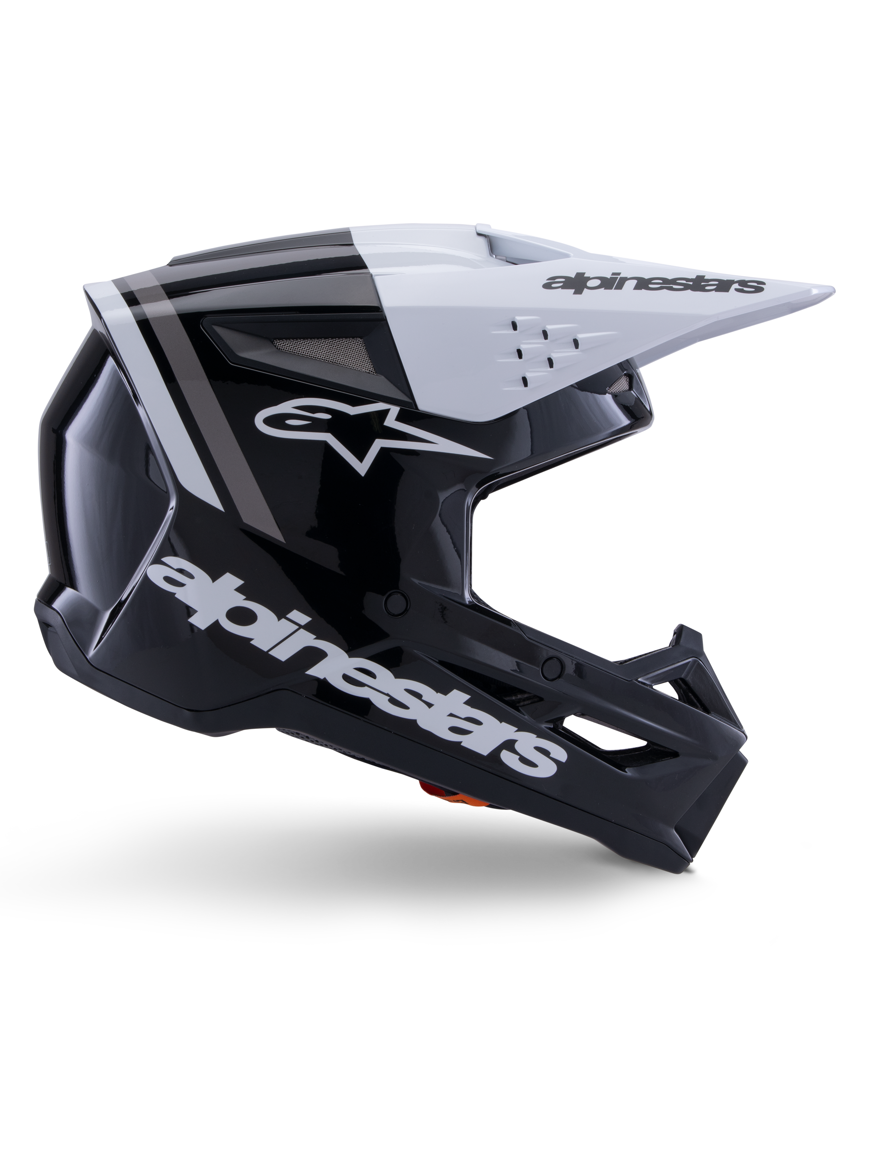Alpinestars S-M3 Radium helm, motorcross off-road helm, glanzend zwart, wit en grijs, hoekig aerodynamisch ontwerp met ventilatieopeningen, zijaanzicht, glanzende afwerking met grijze strepen en een wit vizier met Alpinestars-branding