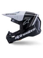 Alpinestars S-M3 Radium helm ECE 22.06, zijaanzicht, glanzende zwart-witte afwerking, grijze racestrepen, wit Alpinestars-logo op de zijkant en het kinstuk, geventileerd ontwerp voor motorcross en enduro