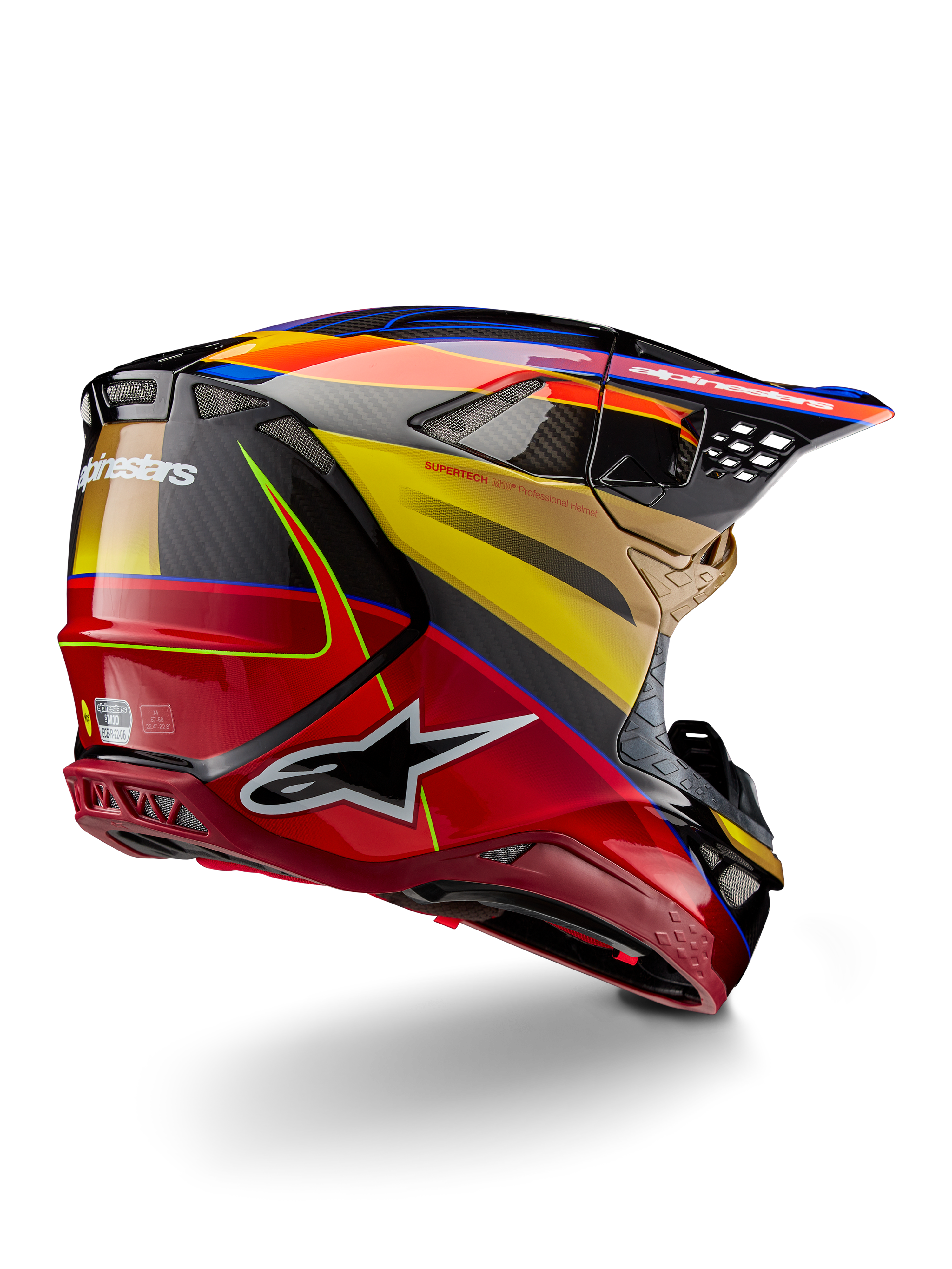 Alpinestars Supertech M10 Era helm, motorcross helm, Gold Yellow Rio Red Glossy, driekwart achteraanzicht met koolstofvezel schaal, rode en gele graphics, blauwe accenten, aerodynamisch profiel met meerdere ventilatieopeningen en opvallend Astar-logo.