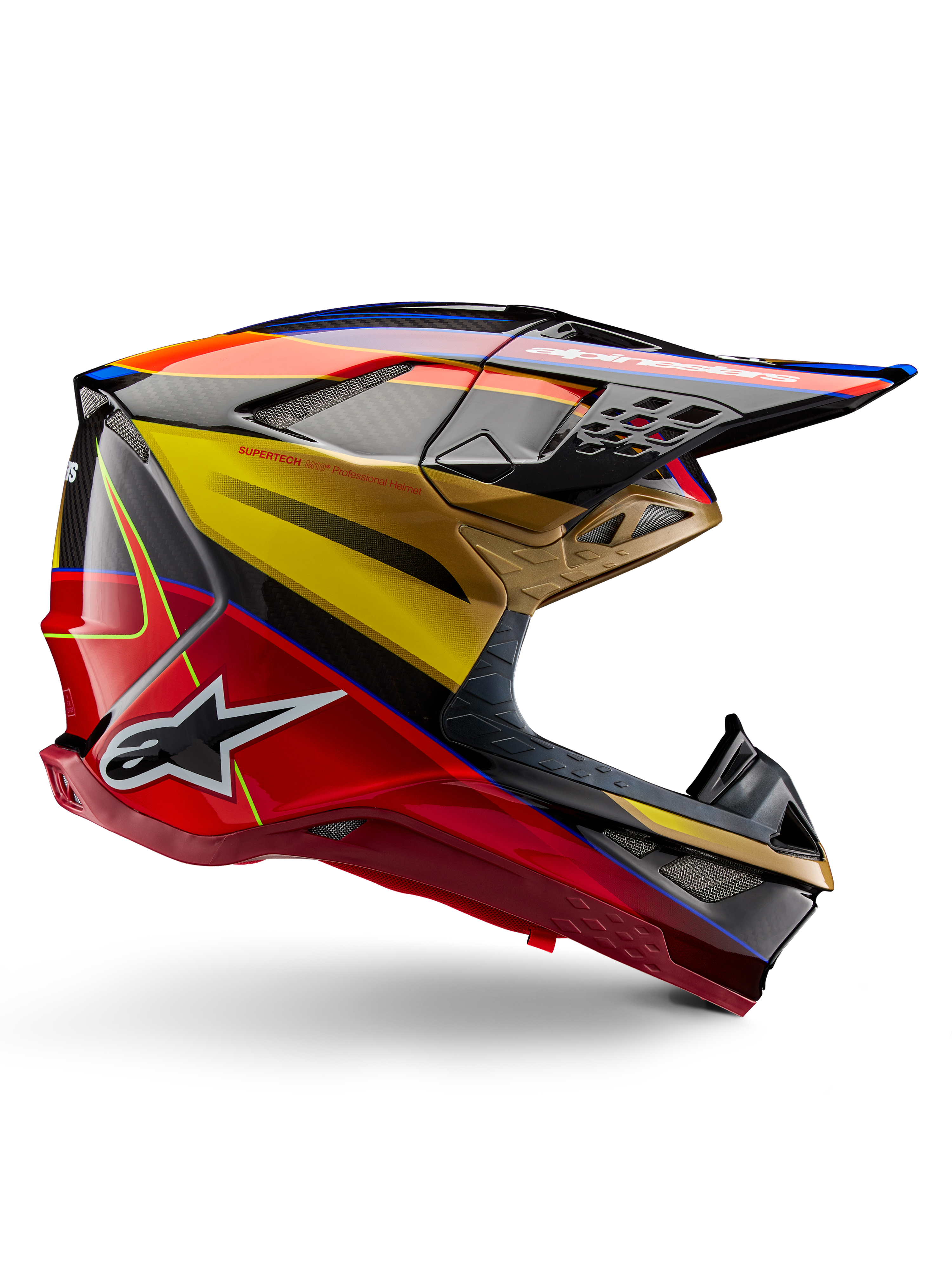 Alpinestars Supertech M10 Era helm, motorcross racinghelm, goudgeel en Rio rood glanzend met blauwe en zwarte accenten, aerodynamisch ontwerp met geïntegreerd vizier, meerdere met gaas bedekte ventilatieopeningen en carbon fiber details, ECE 22.06 gecertificeerd