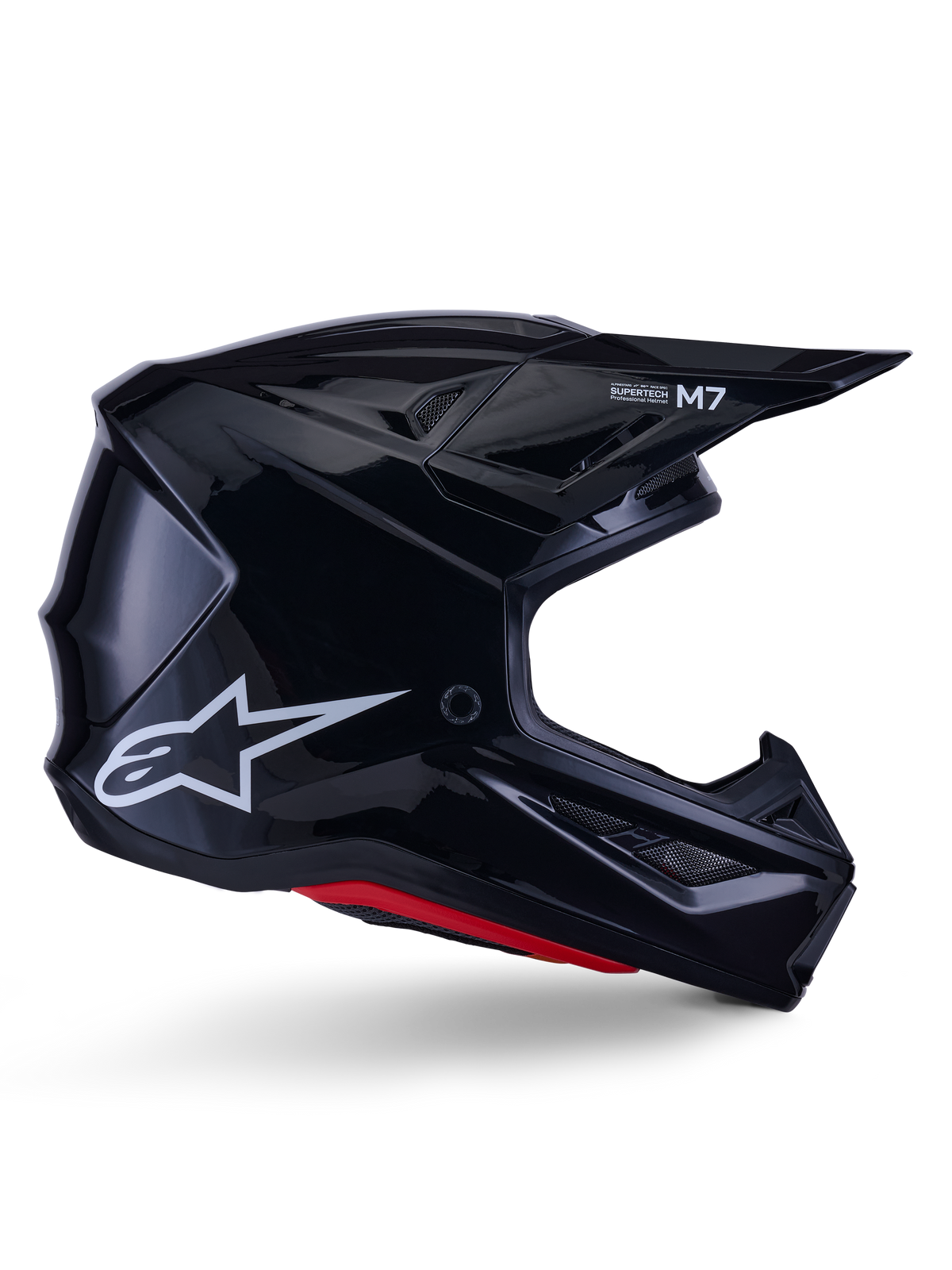 Alpinestars S-M7 Solid Helm, motorcrosshelm, glanzend zwart met wit sterlogo en rode accenten, zijprofiel met aerodynamisch ontwerp, hoekige ventilatieopeningen en Supertech M7-branding op het vizier