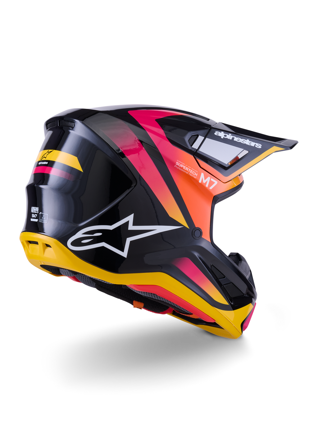 Alpinestars S-M7 Rise helm, motorcrosshelm, zwart, geel en roze glanzend, achter- en zijaanzicht met aerodynamische composietschaal, levendige kleurverlopen, opvallende logo's en ventilatieopeningen