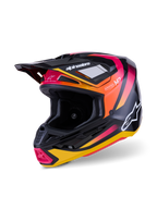 Alpinestars S-M7 Rise helm, motorcrosshelm, glanzend zwart, geel en roze, voorzien van een aerodynamische composiet schaal met levendige graphics met kleurverloop, witte Alpinestars-logo's en meerdere ventilatieopeningen voor off-road racing.