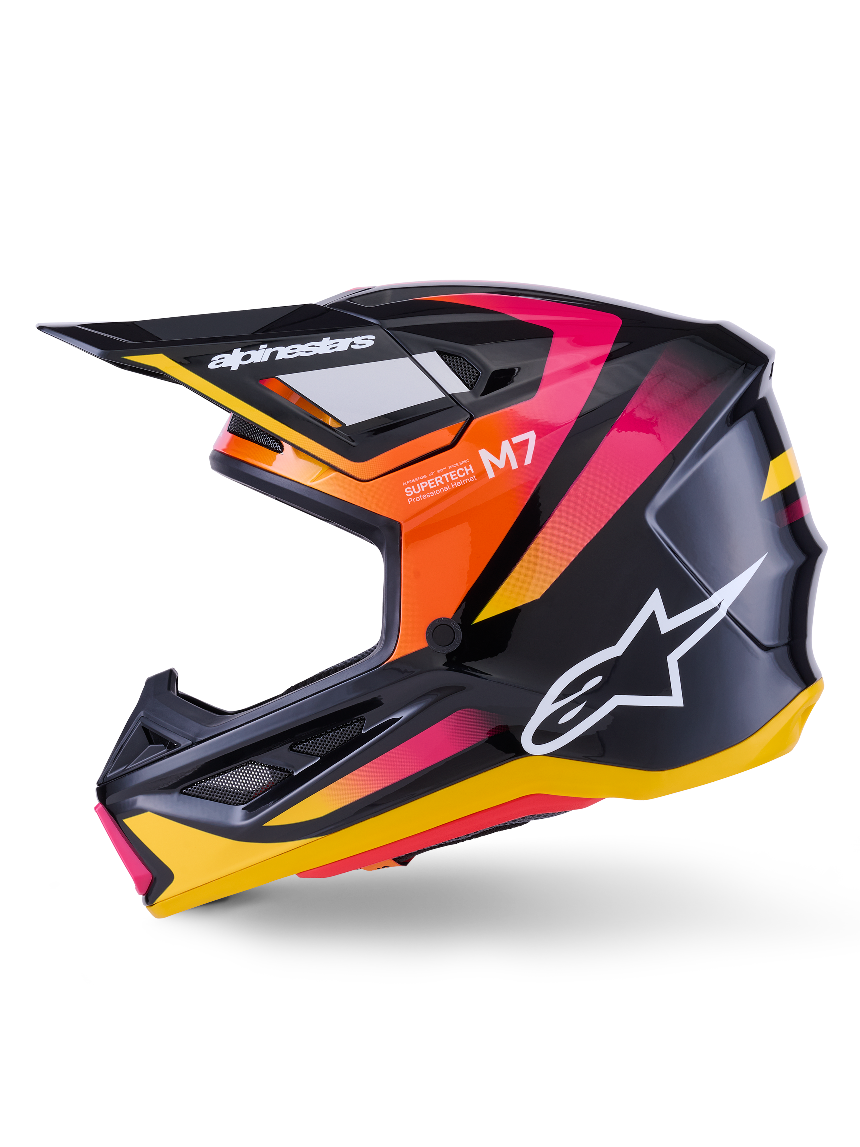 Alpinestars S-M7 Rise helm, motorcrosshelm, glanzend zwart, geel en roze, zijprofiel met levendige oranje en roze kleurverloopaccenten, wit Alpinestars-logo, strak aerodynamisch ontwerp met een zwarte klep, professionele hoofdbescherming voor off-road racen