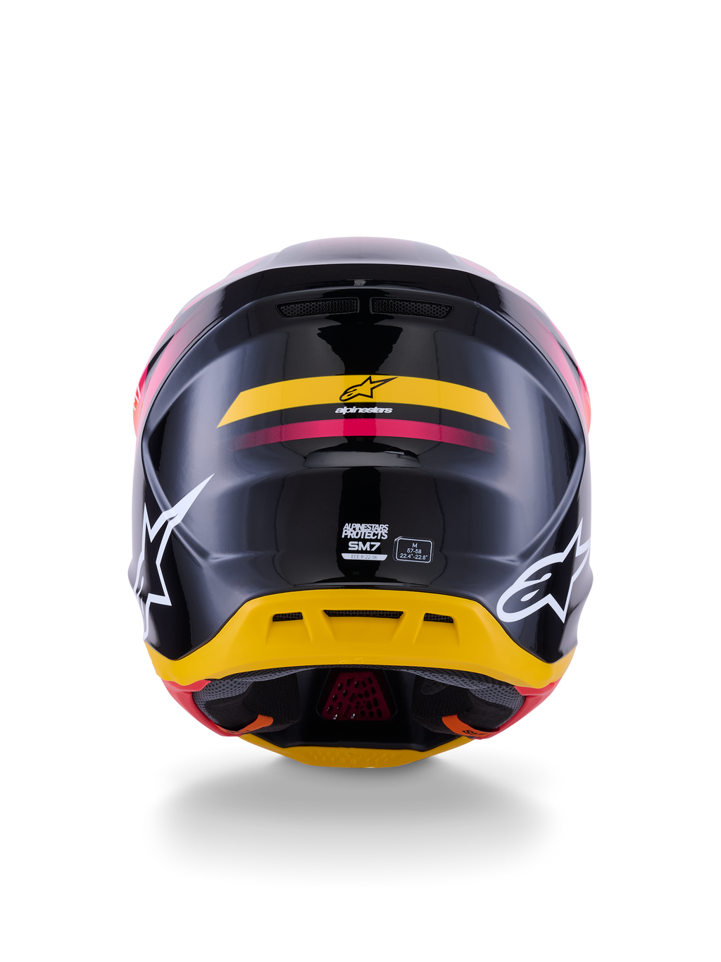 Alpinestars S-M7 Rise helm ECE 22.06, motocrosshelm, achteraanzicht, glanzend zwart met gele en roze accenten, grote witte logo's op de zijkanten, aerodynamische composietschaal, off-road race-uitrusting