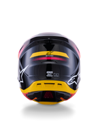 Alpinestars S-M7 Rise helm ECE 22.06, motocrosshelm, achteraanzicht, glanzend zwart met gele en roze accenten, grote witte logo's op de zijkanten, aerodynamische composietschaal, off-road race-uitrusting