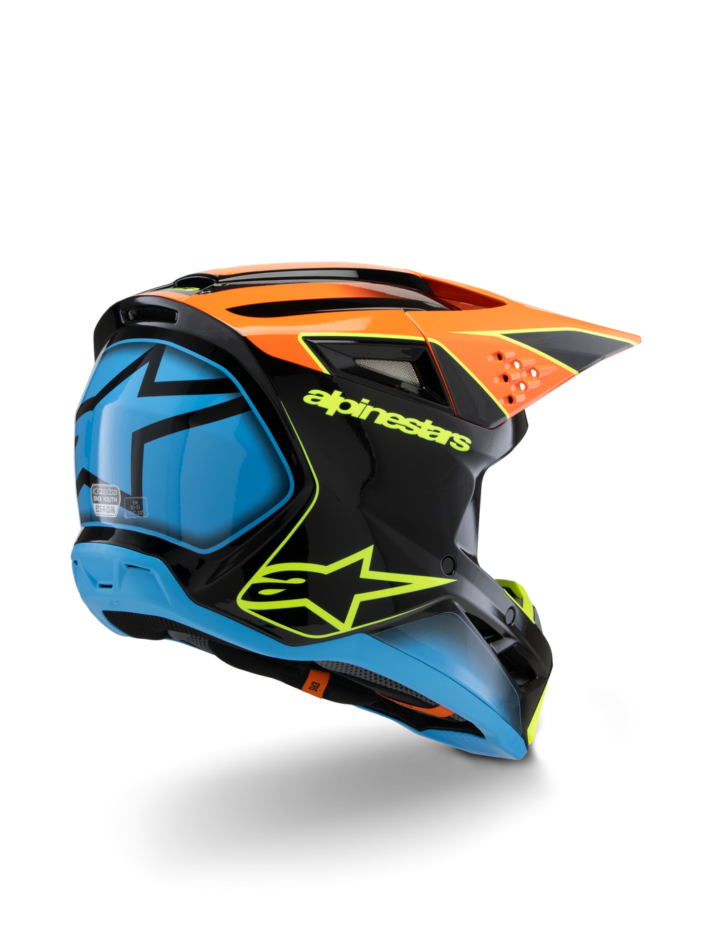 Alpinestars S-M3 Youth Fray helm, motorcrosshelm, zwart, oranje en blauw met neongele accenten, driekwart achteraanzicht toont opvallende Alpinestars-branding en sterlogo, strak aerodynamisch ontwerp voor off-road racen voor de jeugd