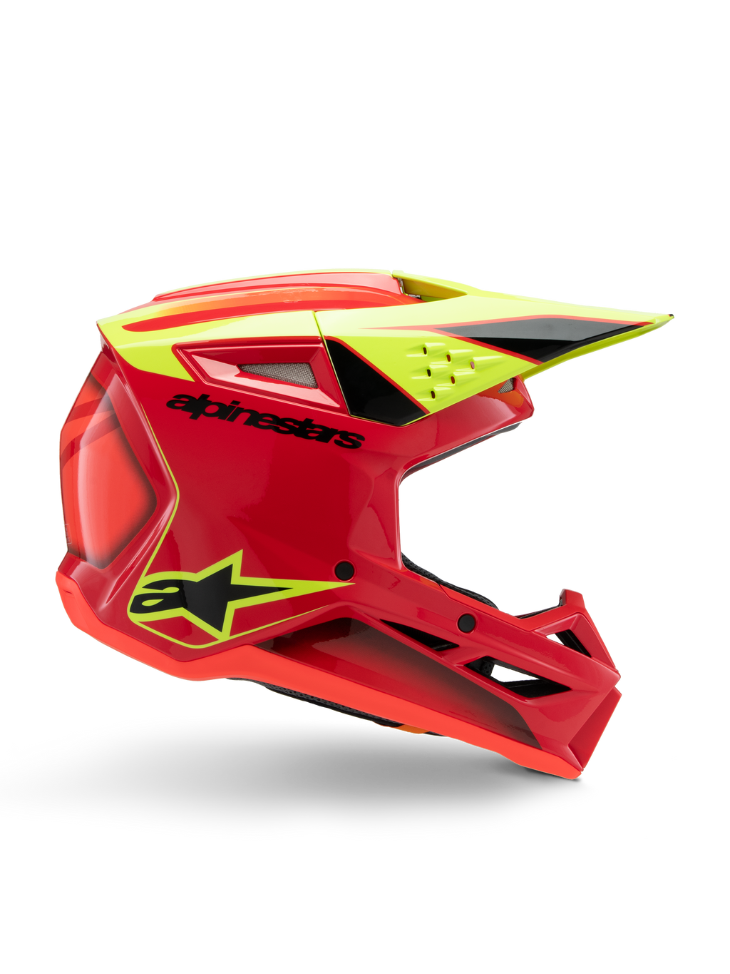 Alpinestars S-M3 Youth Fray Helm, motocrosshelm, rood, fluorgeel en glanzend zwart, zijaanzicht met een gestroomlijnd aerodynamisch ontwerp met geïntegreerd vizier en opvallende ventilatieopeningen, opvallende zwarte branding op een felrode schaal, geoptimaliseerd voor off-road prestaties voor de jeugd