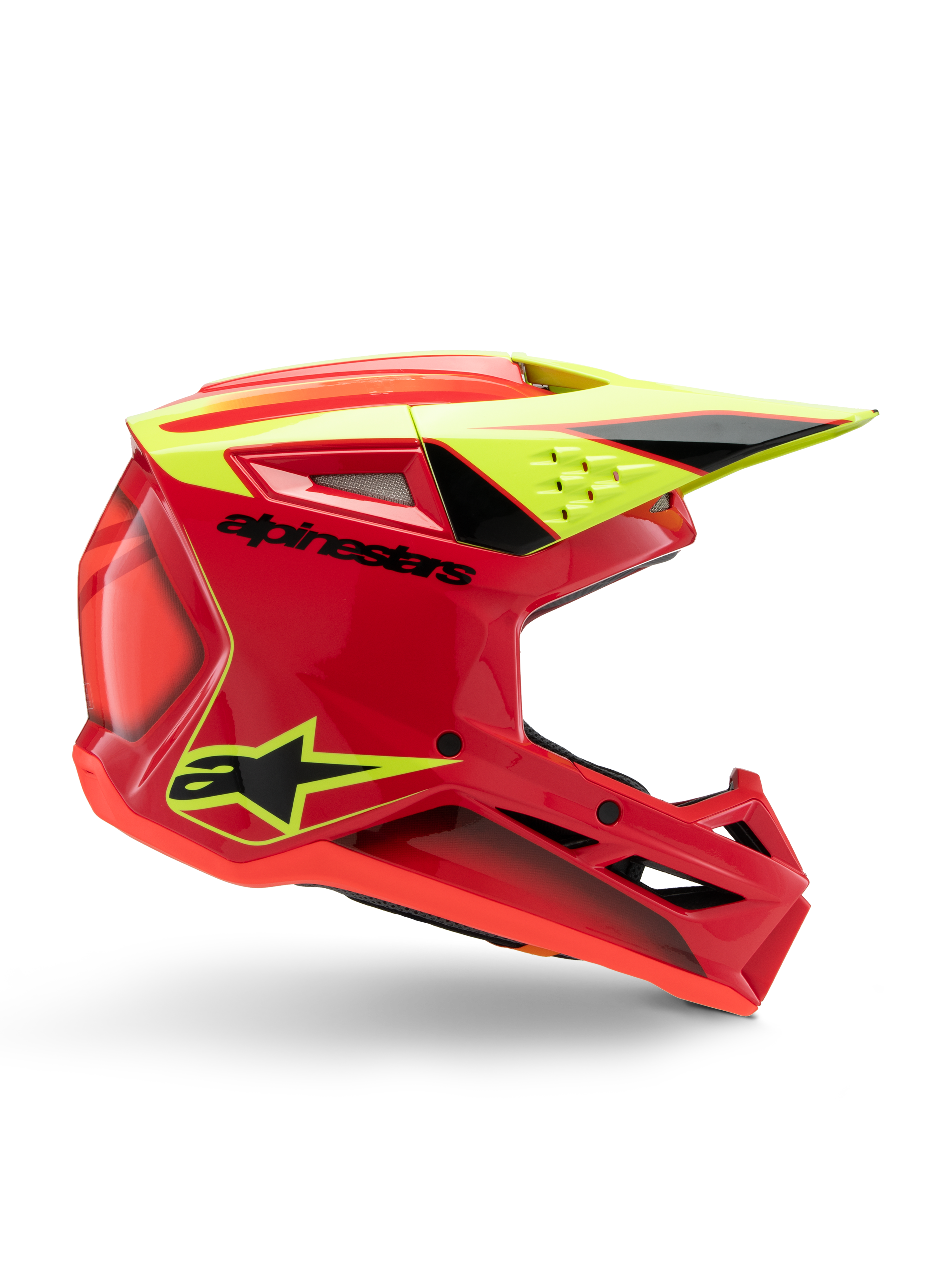 Alpinestars S-M3 Youth Fray Helm, motocrosshelm, rood, fluorgeel en glanzend zwart, zijaanzicht met een gestroomlijnd aerodynamisch ontwerp met geïntegreerd vizier en opvallende ventilatieopeningen, opvallende zwarte branding op een felrode schaal, geoptimaliseerd voor off-road prestaties voor de jeugd