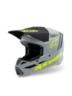 Alpinestars S-M3 Youth Radium Helm ECE 22.06, motorcrosshelm, matgrijs en zwart met fluorescerend gele accenten, voorzien van opvallende Alpinestars-branding en sterlogo, off-road beschermingsuitrusting voor de jeugd