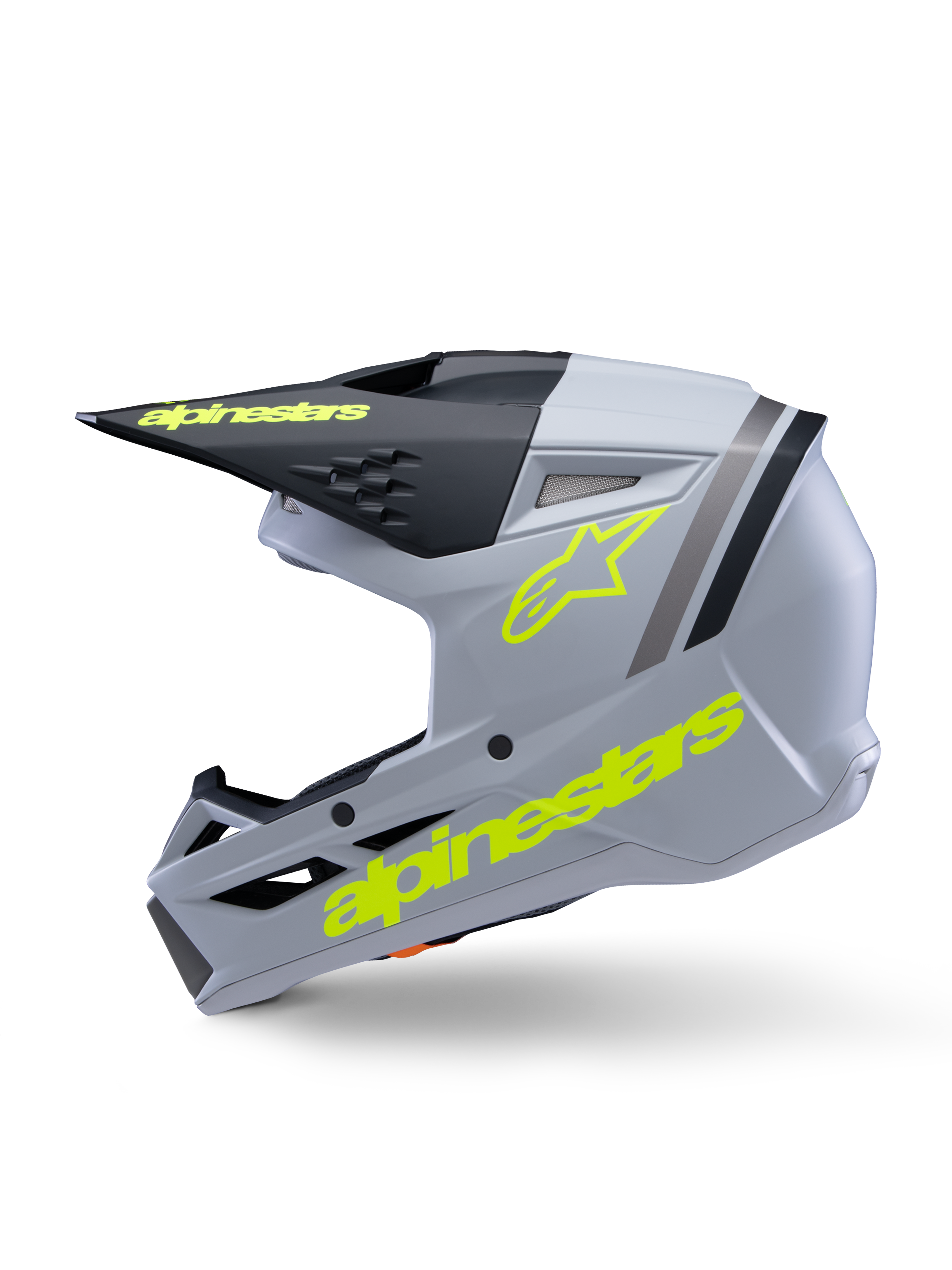 Alpinestars S-M3 Jeugd Radium Helm ECE 22.06, motorcrosshelm, grijs, zwart en mat fluogeel, zijaanzicht met fluorescerend gele Alpinestars-logo's en zwart vizier, gestroomlijnde beschermende uitrusting voor jonge rijders