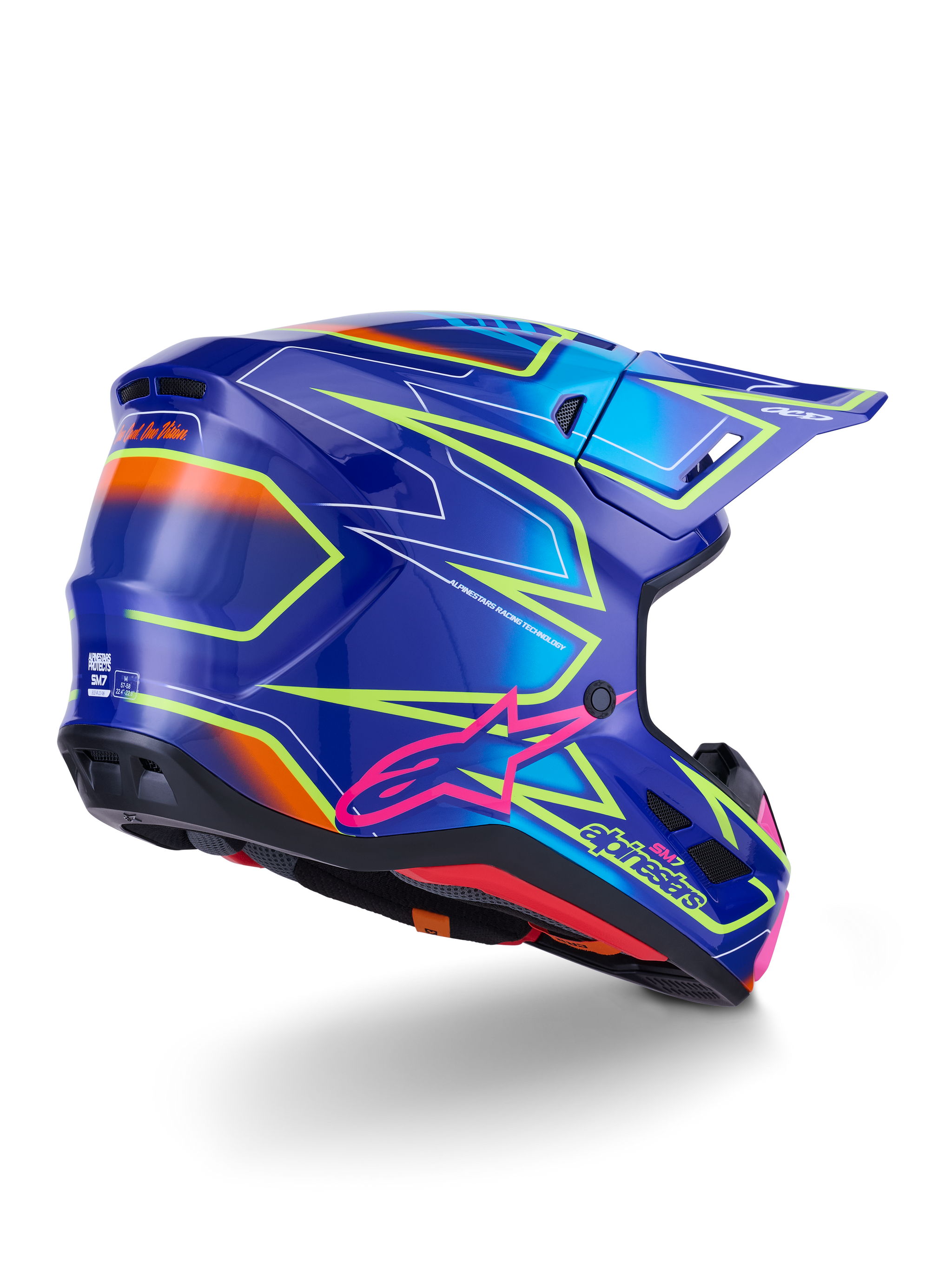 Alpinestars S-M7 Cast Helm, motocrosshelm, blauw, roze en geel fluo glanzend, driekwart achteraanzicht met aerodynamische schaal, opvallende hoekige graphics, roze Astar-logo en geïntegreerde ventilatieopeningen voor off-road racing