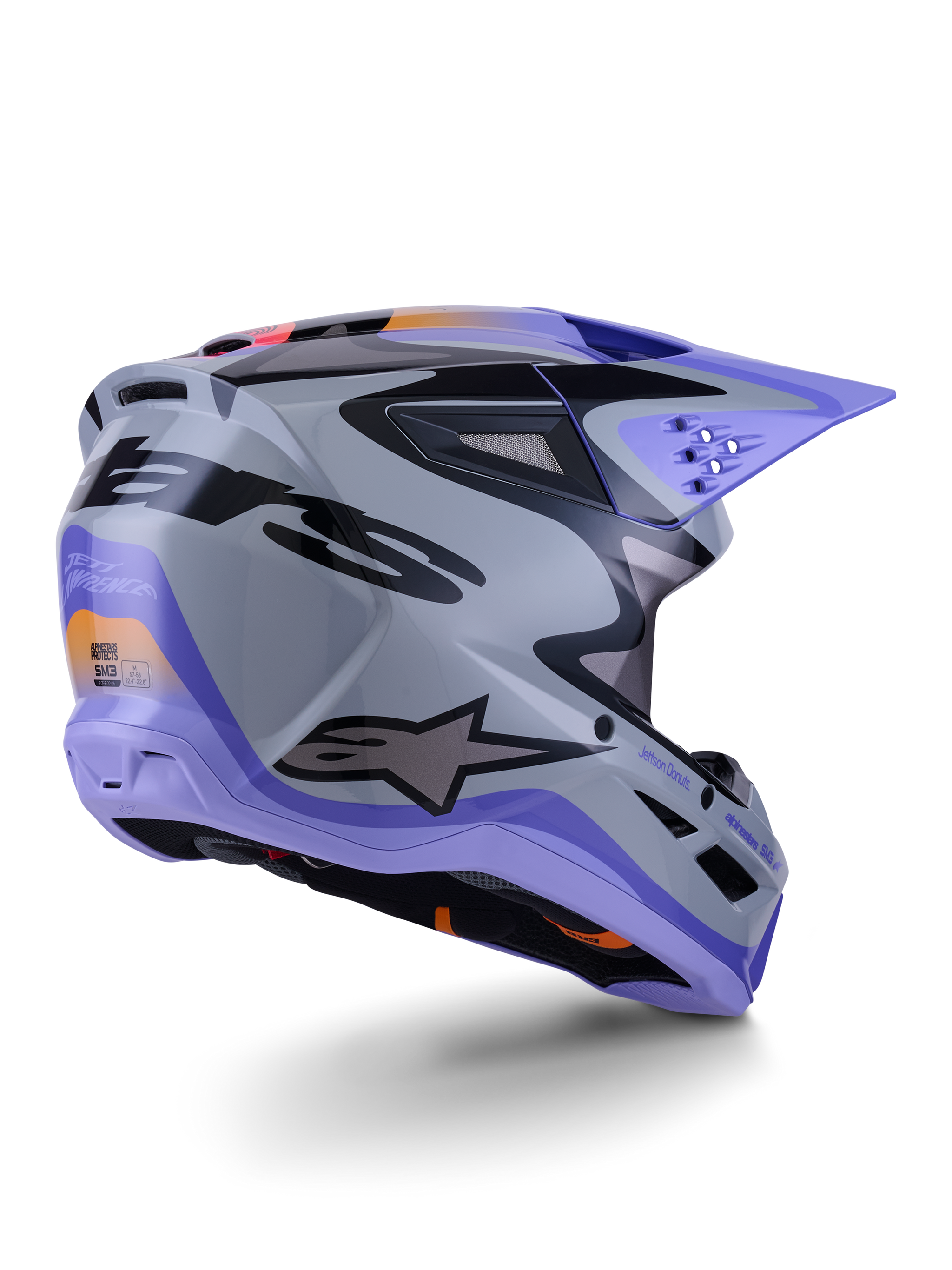 Alpinestars S-M3 Jettson Helm ECE 22.06, motorcrosshelm, grijs, paars en zwart glanzend, driekwart achteraanzicht met aerodynamische thermo-geïnjecteerde schaal, ventilatieopeningen en opvallend grafisch ontwerp