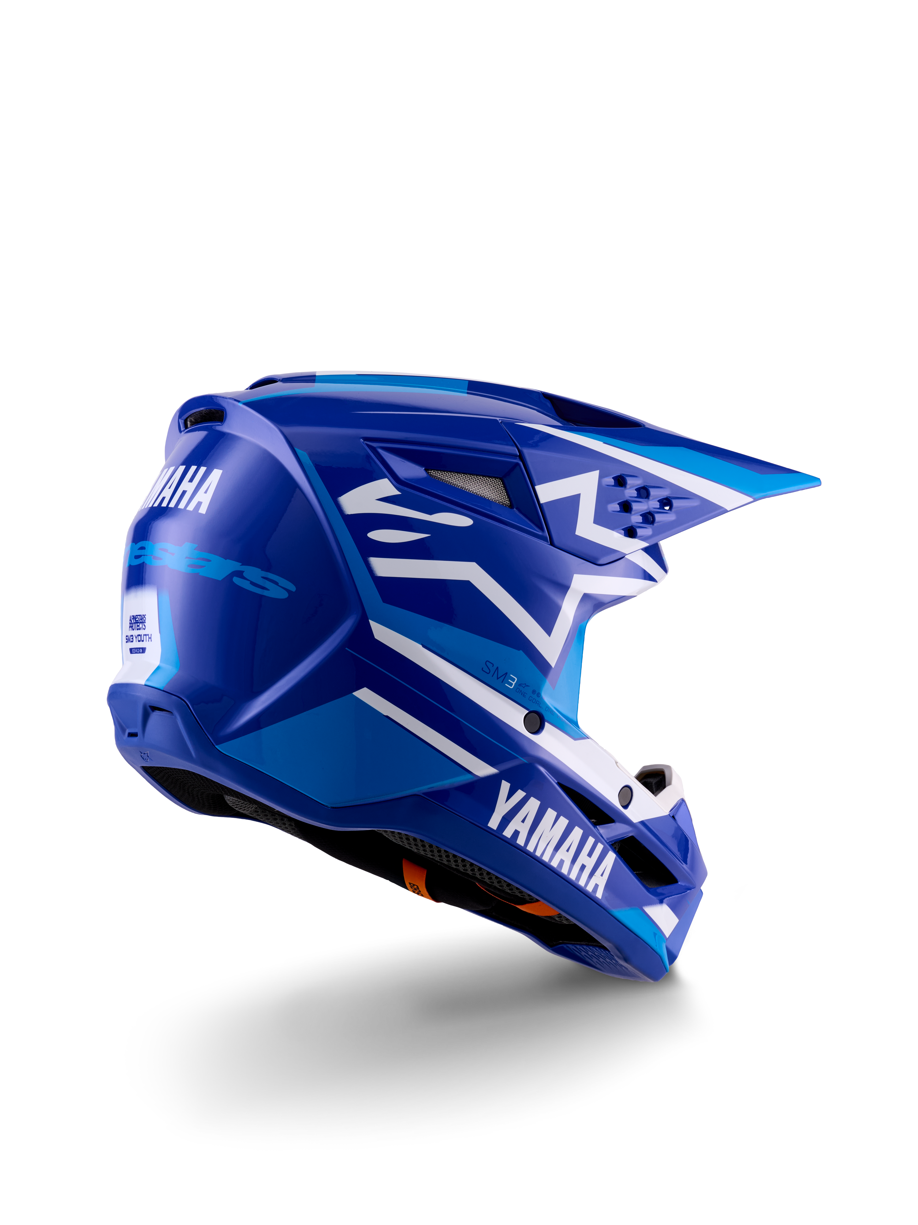 Alpinestars Yamaha S-M3 jeugd motocrosshelm, blauw en wit glanzend, voorzien van opvallende Yamaha-branding op de zijkant en achterkant, aerodynamisch schaalontwerp met ventilatie aan de achterzijde, jeugdspecifieke off-road hoofdbescherming in een driekwart achteraanzicht.