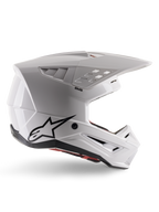 Alpinestars S-M5 Solid Helmet ECE 22.06, Motocross Helmet, White Glossy, side profile featuring an angular aerodynamic design, prominent peak visor, integrated air vents, black Astars logo on the rear, and visible red interior padding