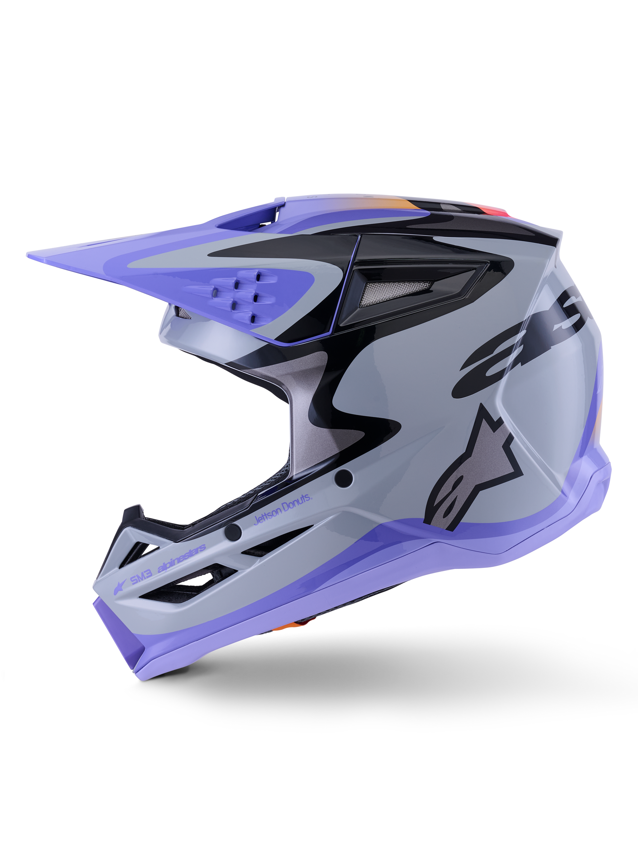 Alpinestars S-M3 Jettson helm, motorcrosshelm, glanzend grijs, paars en zwart, zijaanzicht met strakke graphics en verstelbaar vizier, voorzien van meerdere ventilatieopeningen en Alpinestars-branding, hoogwaardige off-road bescherming