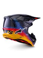 Alpinestars Limited Edition Supertech M10 Black Hole Helmet, Motocross Helmet, Black Burst Glossy featuring a vibrant yellow to red and blue speckled gradient, lightweight carbon fiber shell with white A-star logo and integrated mesh exhaust vents