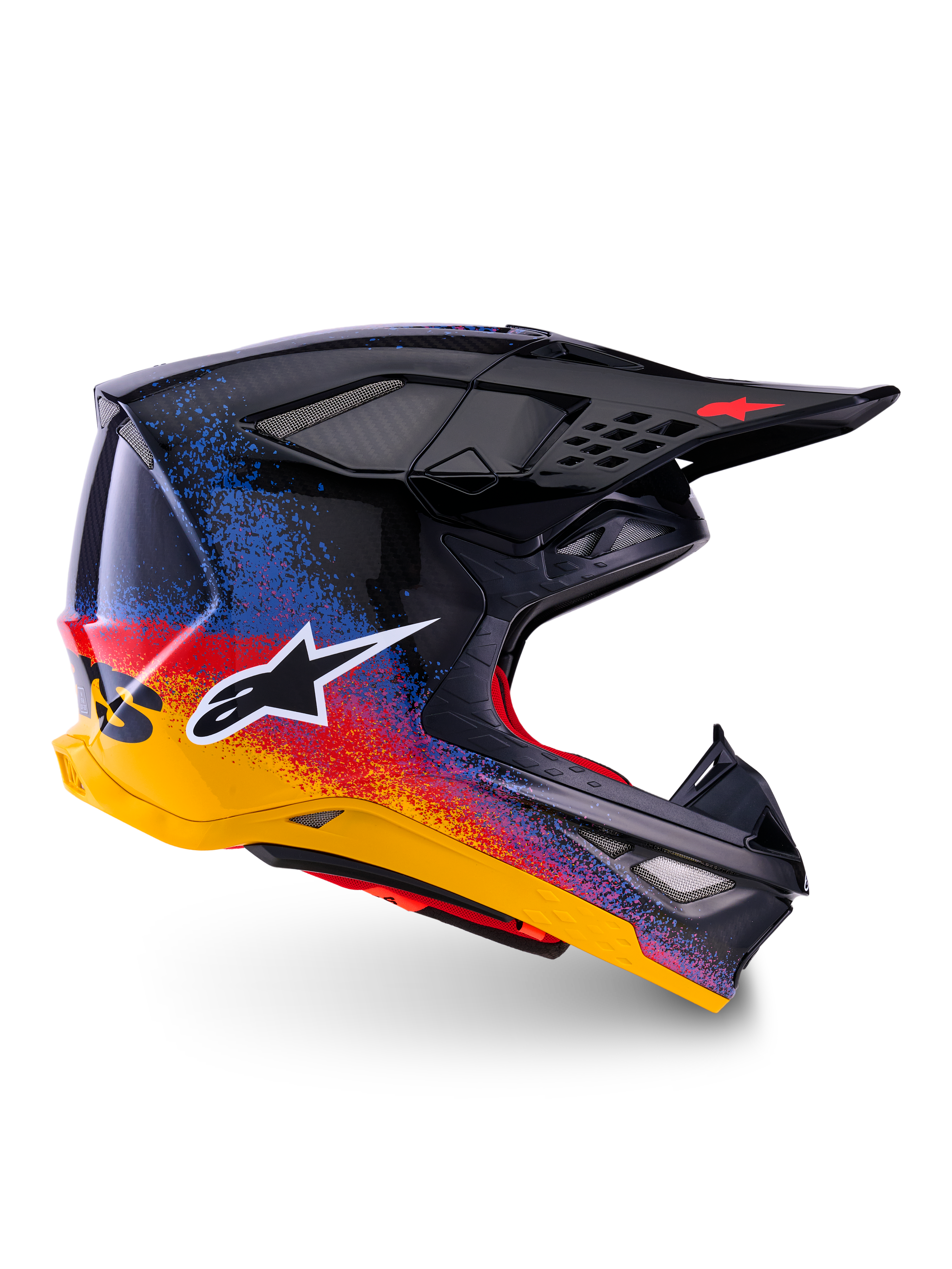 Alpinestars Limited Edition Supertech M10 Black Hole motorcrosshelm, zwarte schaal met een rood, blauw en geel gradiënt spetterontwerp, wit sterlogo op de zijkant, aerodynamisch profiel met ventilatieopeningen bedekt met gaas, rode binnenvoering en een lang zwart vizier.