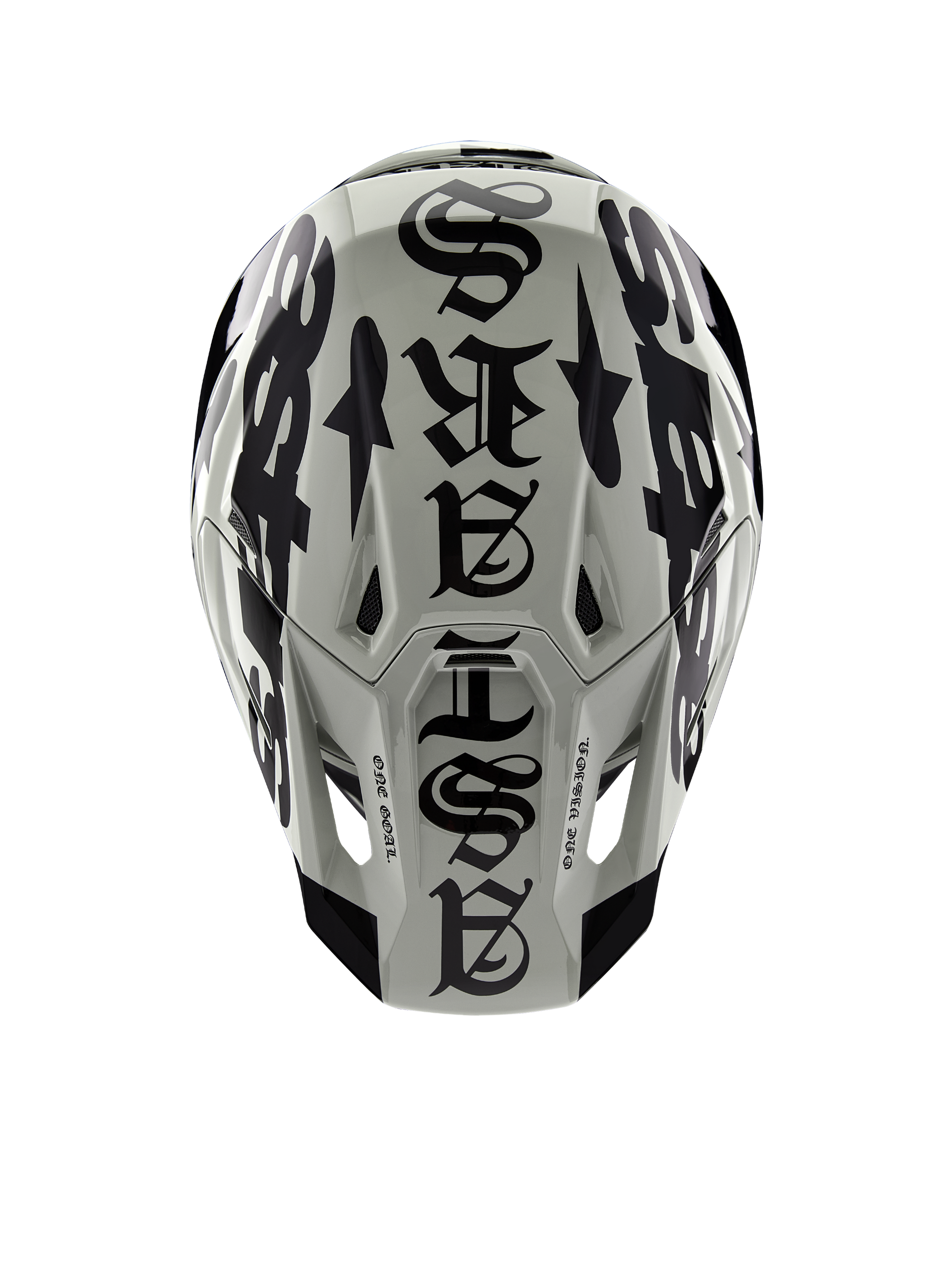 Alpinestars Limited Edition S-M7 Wolf Dust Helmet, top view, Dune and Black glossy finish, featuring bold gothic-style typography across the crown and One Goal One Vision detailing, professional motocross racing head protection