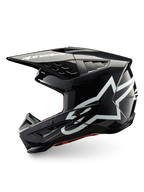 Alpinestars S-M5 Corp helm, donkergrijs glanzende motocrosshelm met witte logo's, ECE 22.06-gecertificeerd voor off-road rijden.