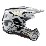 Alpinestars S-M5 Mineral ECE helm, motorcrosshelm, koel grijs en donkergrijs glanzend, zwart-wit grafisch patroon geïnspireerd op mineralen, zijaanzicht met aerodynamisch vizier en ventilatieopeningen.