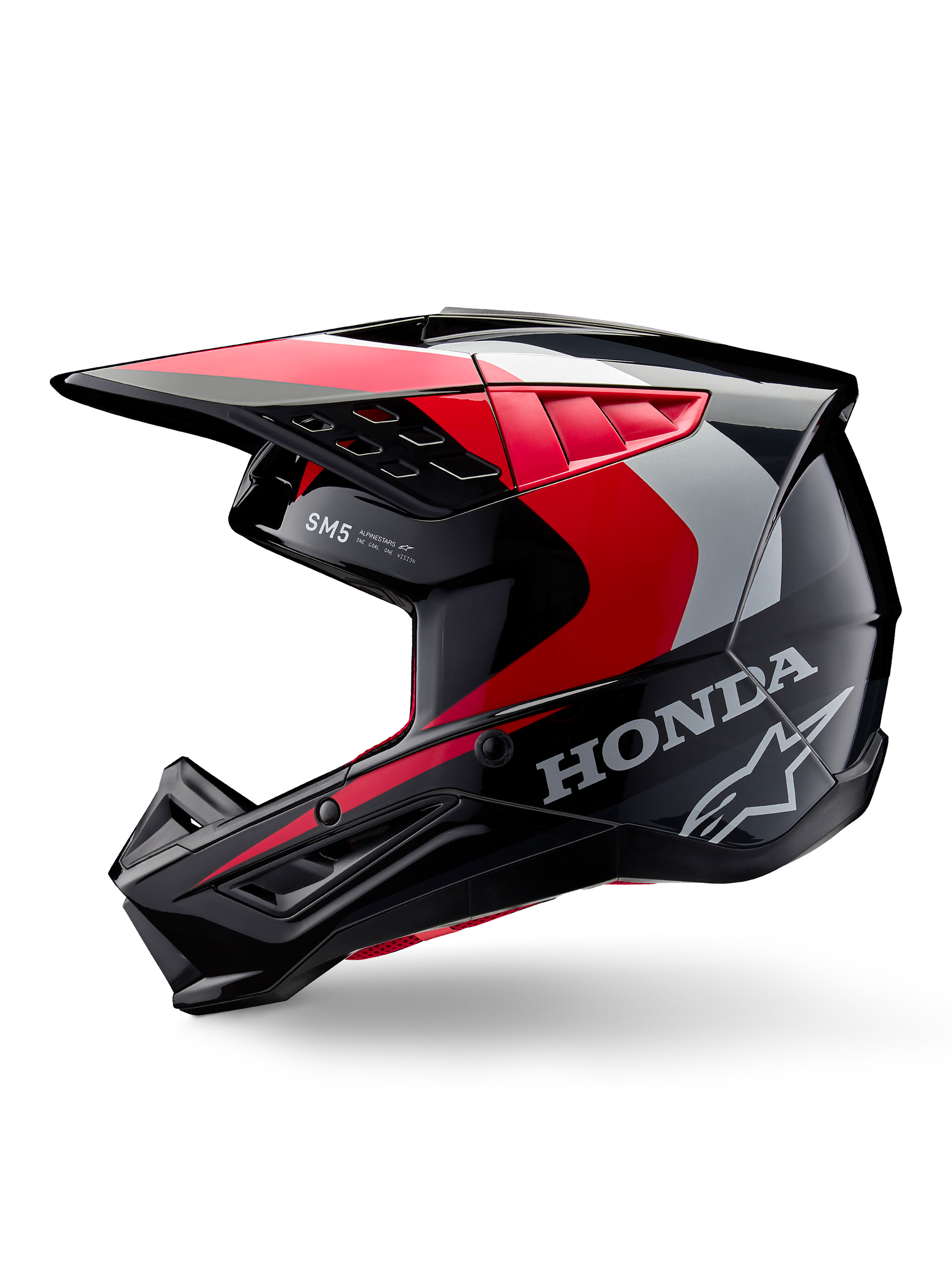Alpinestars Honda S-M5 helm, motorcrosshelm, glanzend zwart met rode en zilveren accenten, zijaanzicht met Honda-branding en Alpinestars sterlogo, strak ontwerp met geïntegreerde klep en ventilatieopeningen voor off-road prestaties