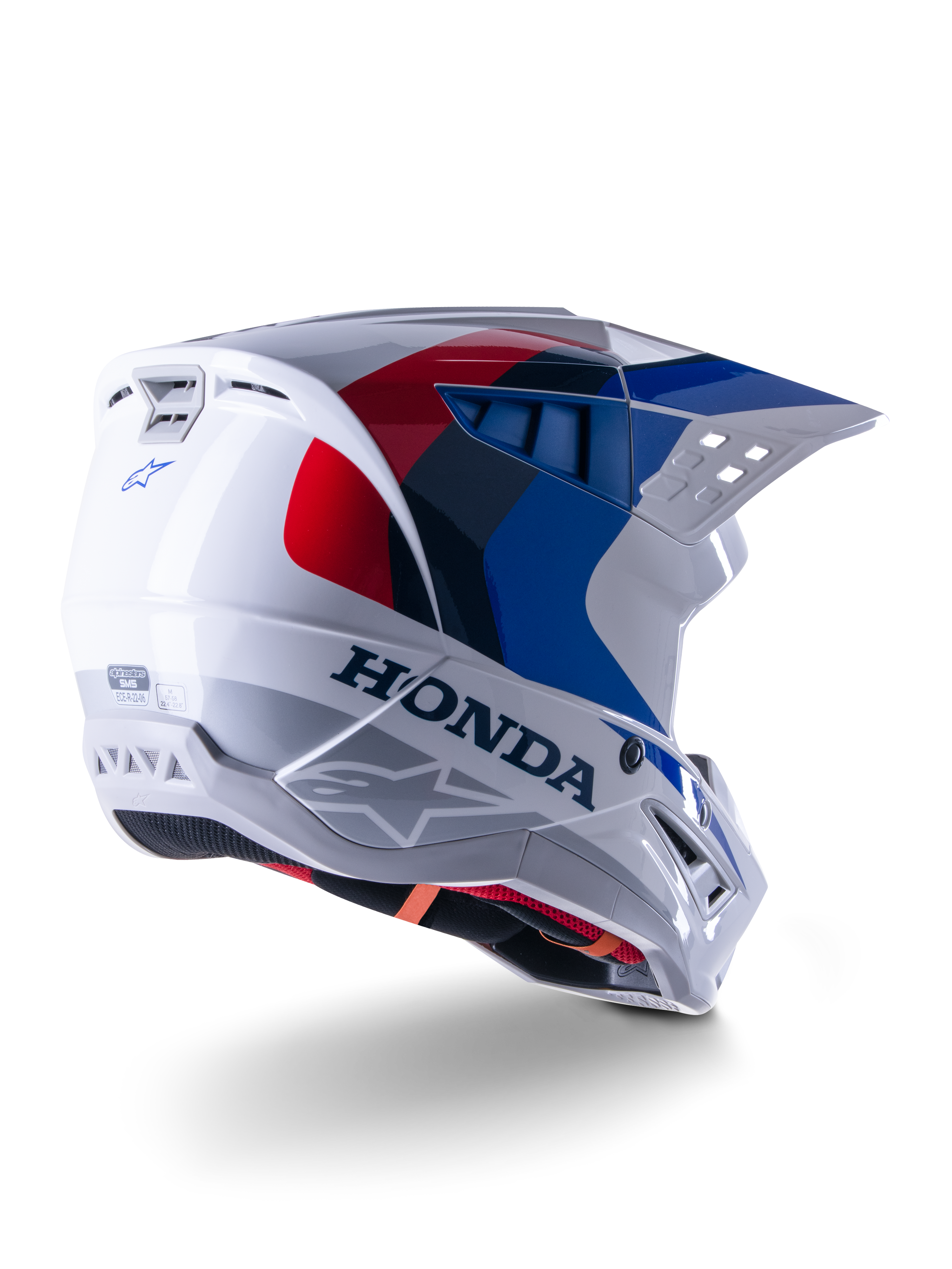 Alpinestars Honda S-M5 Helmet ECE, Motocross Helmet, White Blue and Red Glossy, featuring bold Honda branding and Alpinestars logos, aerodynamic shell with integrated ventilation ports and adjustable visor, protective gear for off-road racing