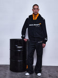 Alpinestars RSRV Arena Suit Jacket, zwart motorjas met oranje voering, McLaren Racing samenwerking, premium streetwear collectie, unisex design