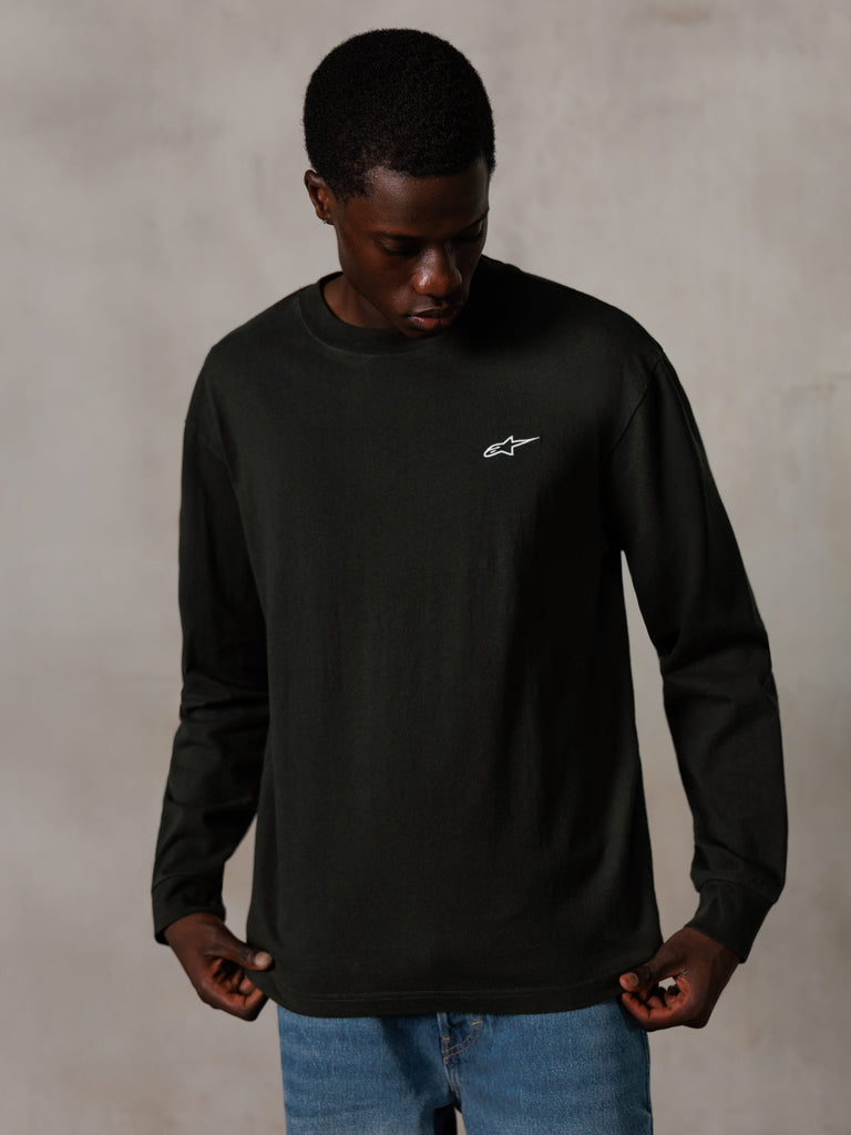 Alpinestars Essentials Ageless LS Tee, Long-Sleeve T-Shirt, Off Black, featuring a small white logo on the chest, worn by a model with blue jeans, casual lifestyle streetwear