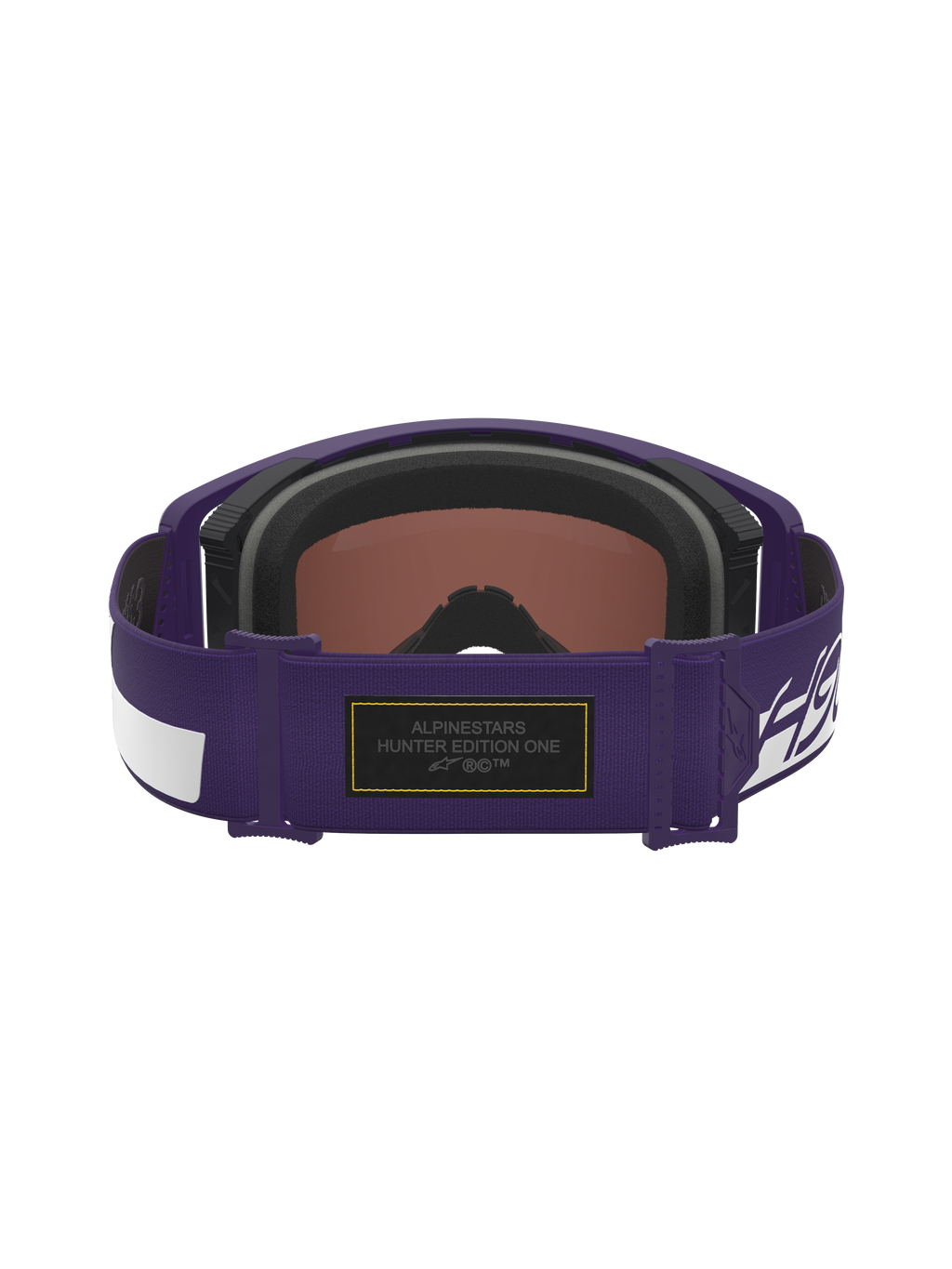 Alpinestars Limited Edition HUNTA96 XXV Supertech Vision Goggles, paars en wit, achteraanzicht van de verstelbare band met zwarte Alcantara-patch met geel contraststiksel en Hunter Edition One-branding, premium motorcrossbril geïnspireerd op de Porsche GT3RS