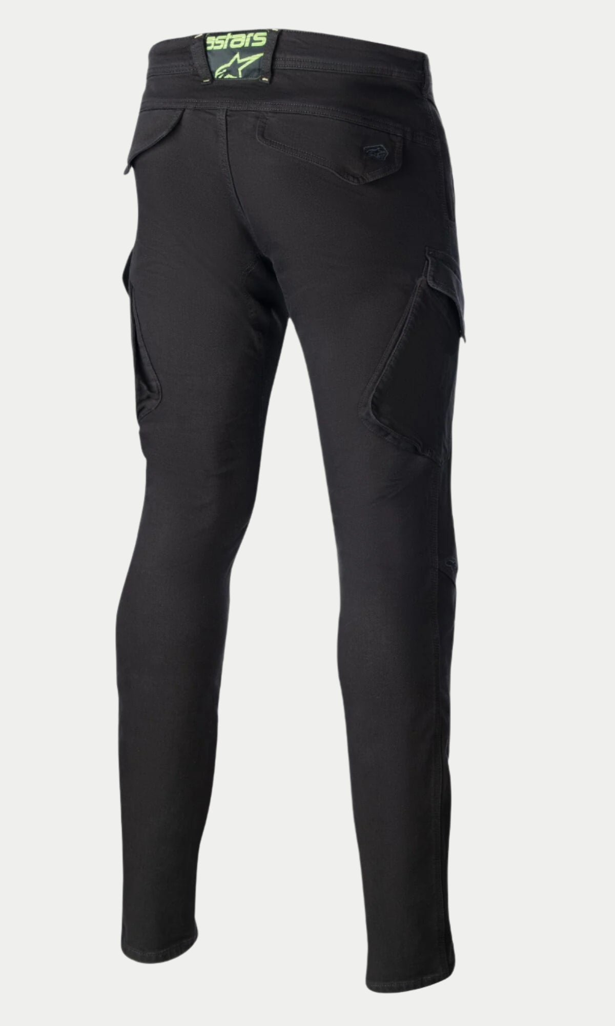 Alpinestars Caliber Slim Fit Tech Riding Pants, zwarte motorbroek, achteraanzicht met de slanke taps toelopende pasvorm, combat-stijl cargozakken en achterzakken met klep, limoengroene logopatch op de tailleband