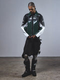 RSRV Alloy Leather Jacket, Premium Streetwear Motorcycle Jacket, Green Black and White, Glossy Leather Construction, RSRV Logo Branding, Worn with Black Boots and Metallic Accent Pants