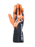 Alpinestars Tech-1 K V3 handschoenen, karthandschoenen, zwart, oranje en wit, voorzien van een gesublimeerd grafisch ontwerp met oranje penseelstreekpatronen op een zwarte basis, groot wit Astar-logo op de handrug, verticale Alpinestars-tekst op de manchet, professionele kartuitrusting