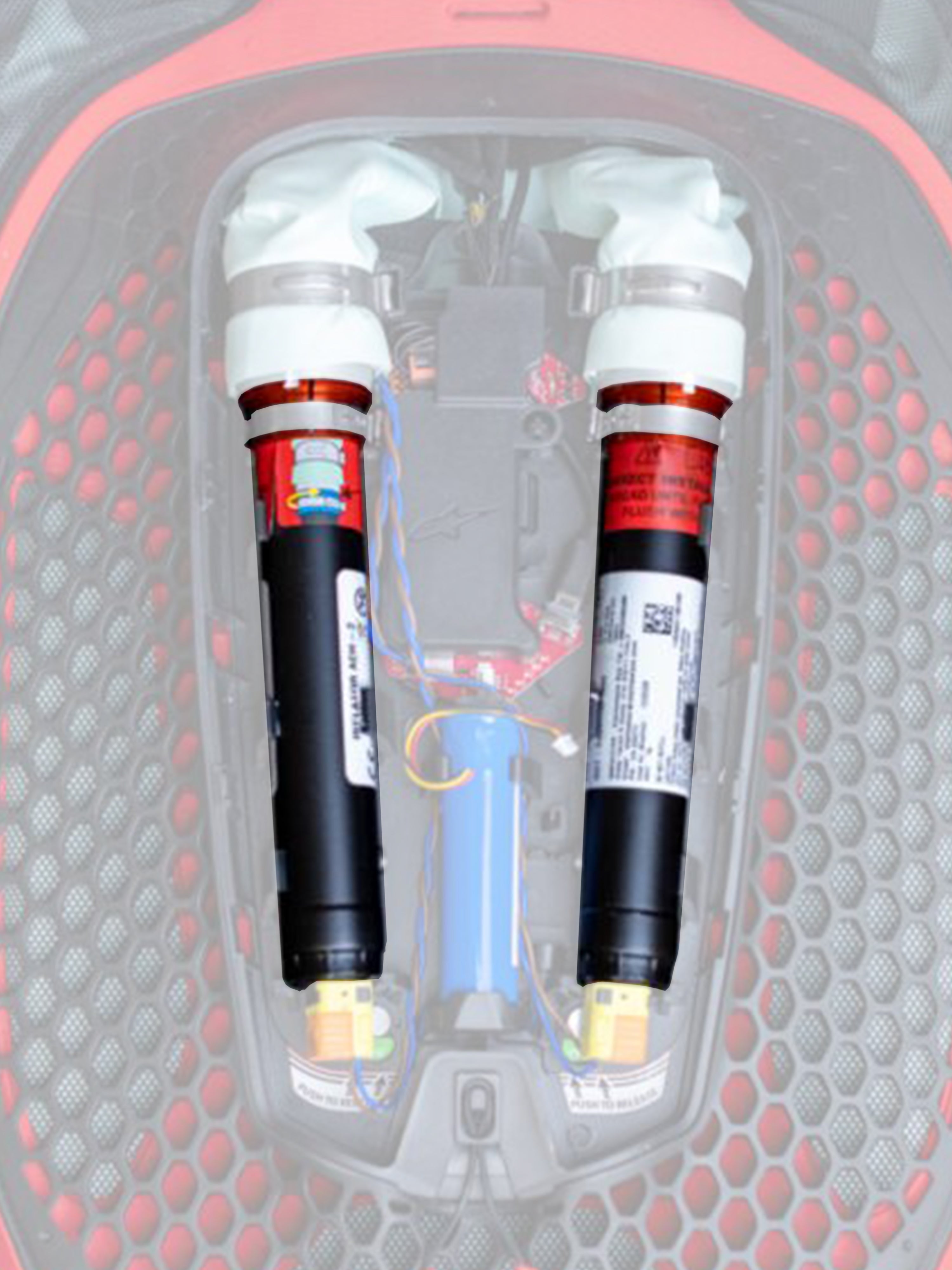 Alpinestars Tech-Air 7X & Off-Road vervangingscanisterset, airbag vervangingspatronen, zwart met witte bovenkanten en oranje banden, twee argon-canisters geïnstalleerd in een rood-zwart elektronisch airbagsysteem met honingraatpatroon en gekleurde bedrading